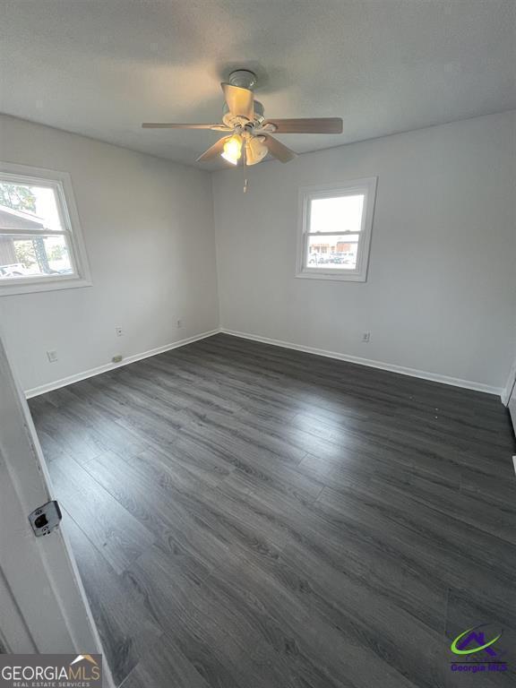 321 Mary Lane Warner Robins, GA 31088 - Photo 3 of 11 an empty room with wooden floor and windows
