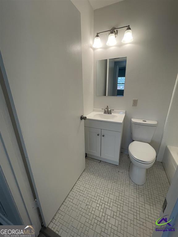 321 Mary Lane Warner Robins, GA 31088 - Photo 9 of 11 a bathroom with a toilet a sink and mirror