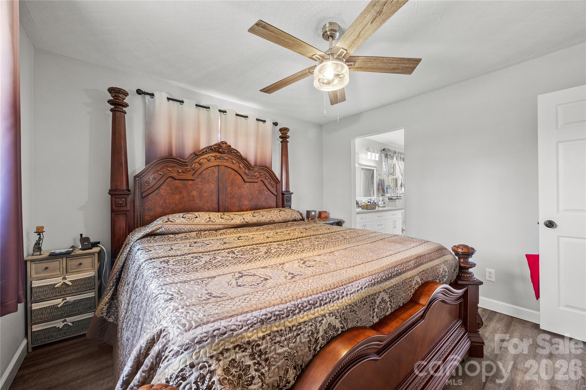 7137 Reeps Grove Church Road Vale, NC 28168 - Photo 12 of 33 a bedroom with a bed and a chandelier