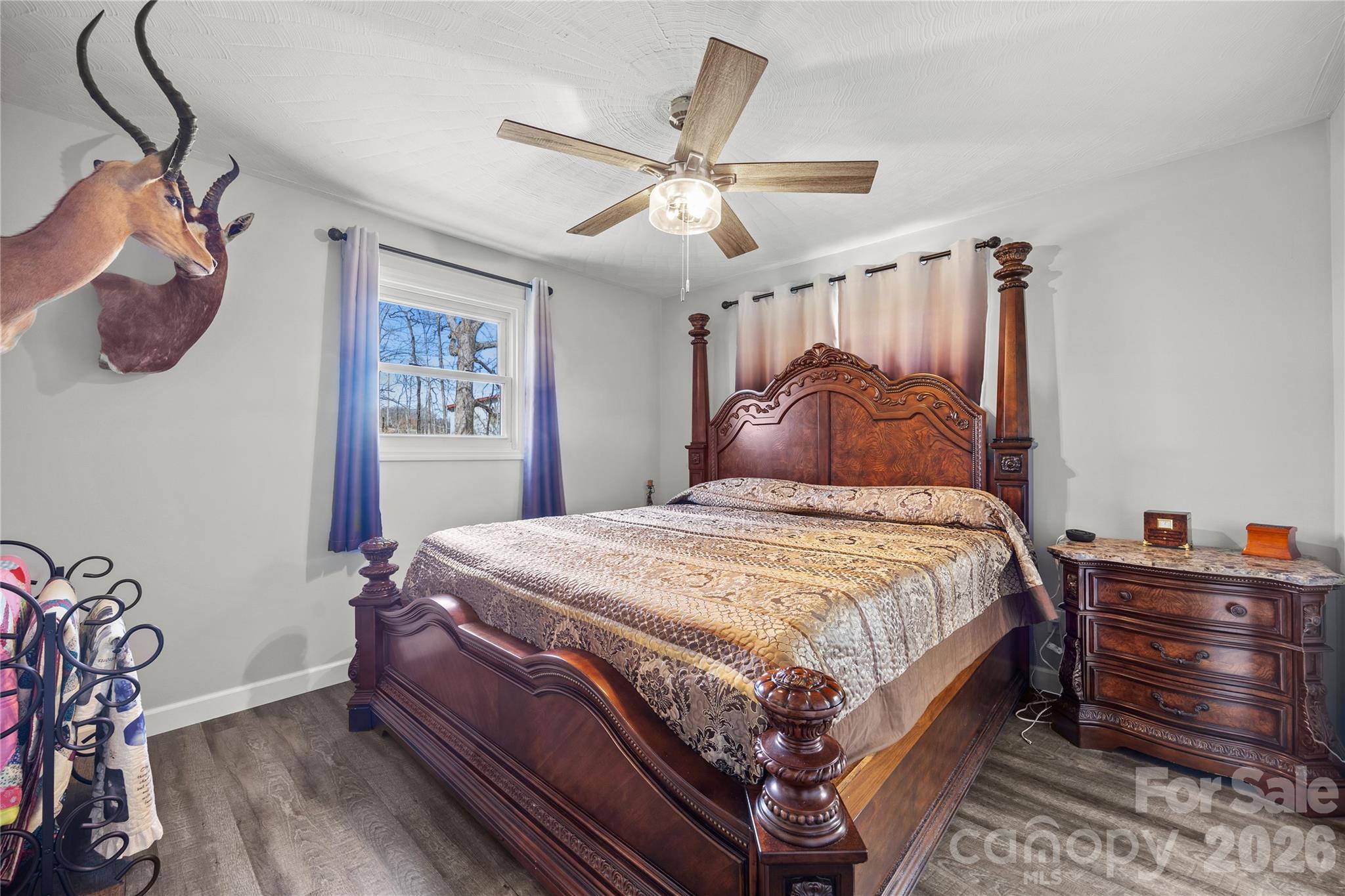 7137 Reeps Grove Church Road Vale, NC 28168 - Photo 13 of 33 a bedroom with a bed and a chandelier