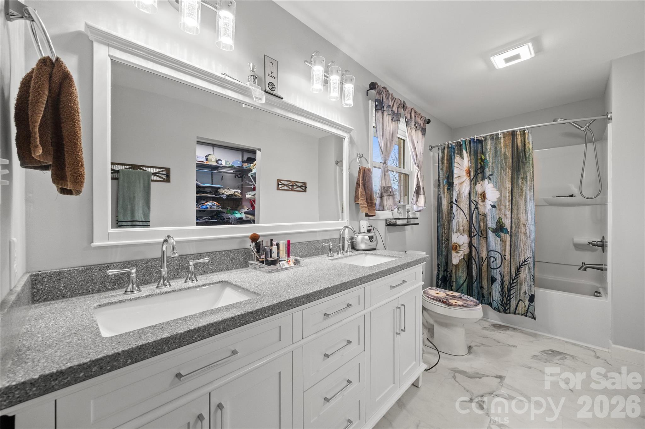 7137 Reeps Grove Church Road Vale, NC 28168 - Photo 15 of 33 a bathroom with a granite countertop sink mirror and a toilet