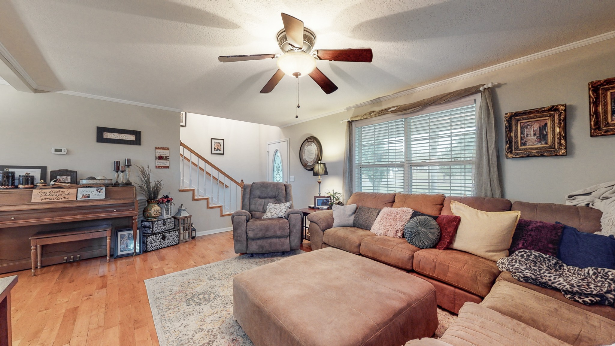 240 Roberts Road Watertown, TN 37184 - Photo 8 of 47 a living room with furniture ceiling fan and a large window