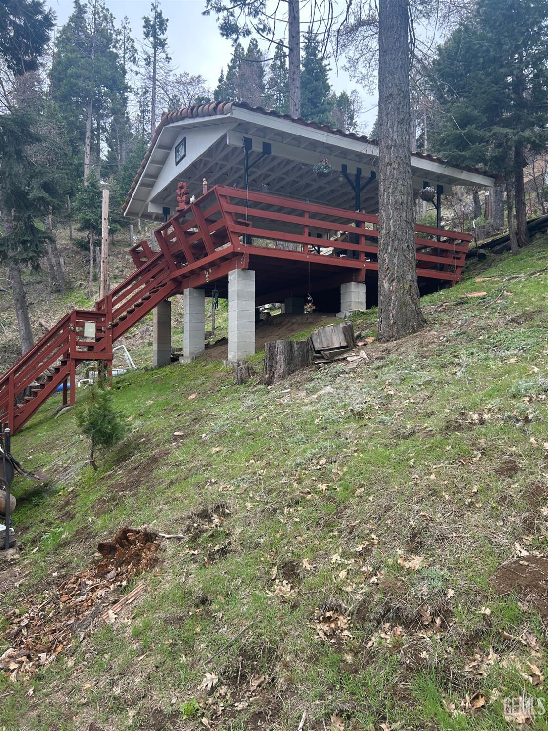 Undisclosed Address Posey, CA 93260 - Photo 15 of 20 a view of a house with a small yard and sitting area