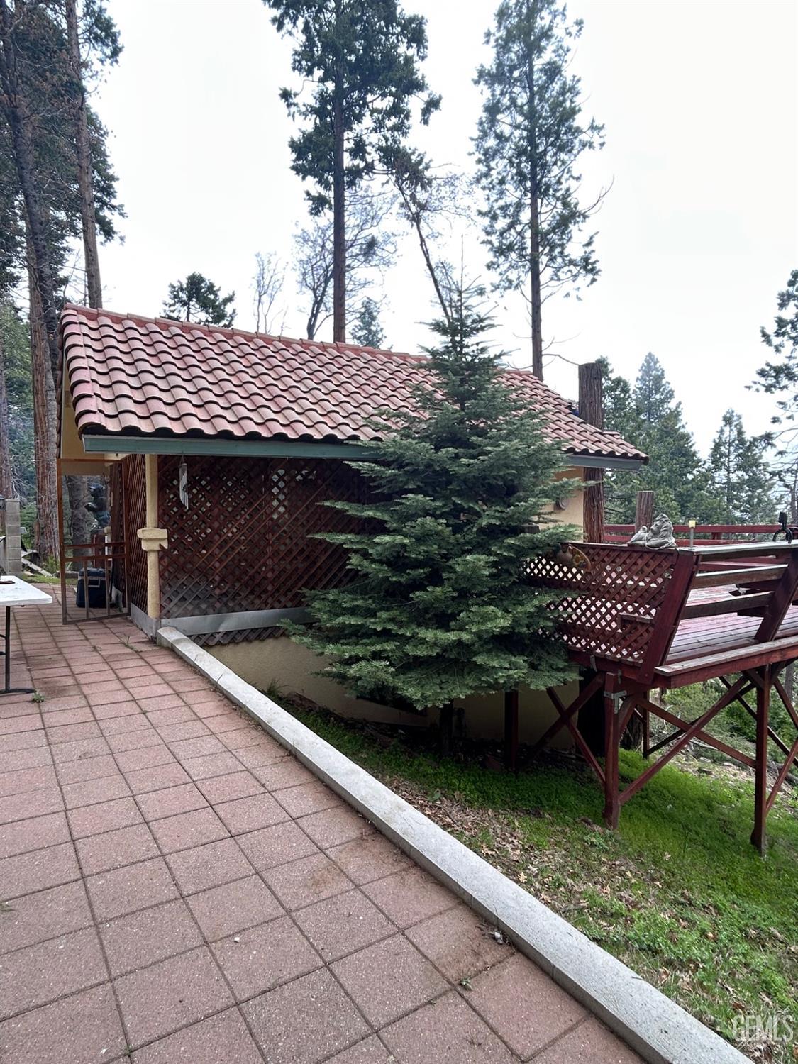 Undisclosed Address Posey, CA 93260 - Photo 8 of 20 a backyard of a house with lots of green space