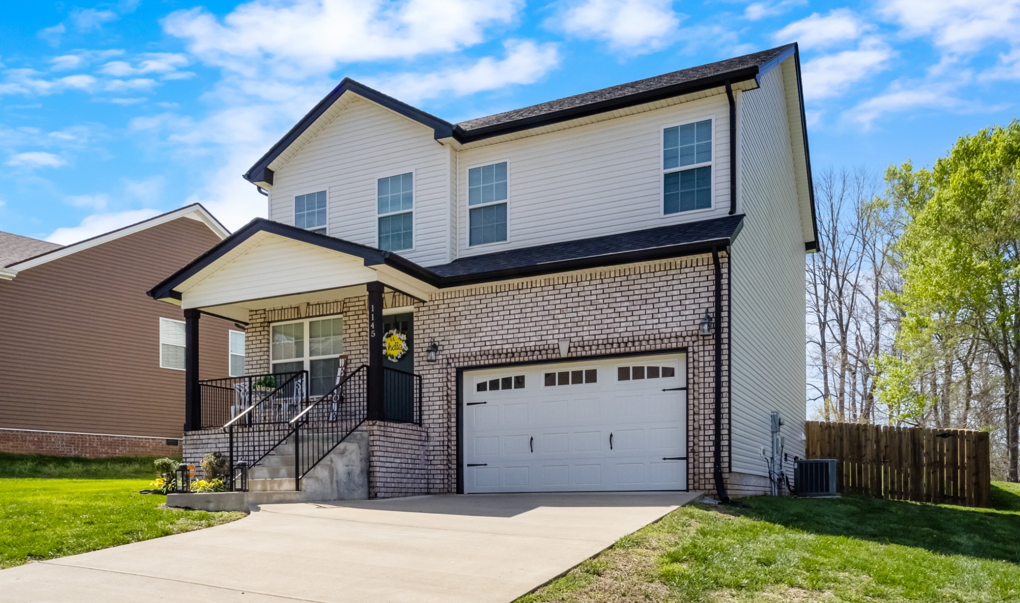 1145 Racker Drive Clarksville, TN 37043 - Photo 2 of 44 a view of a house with a yard and plants