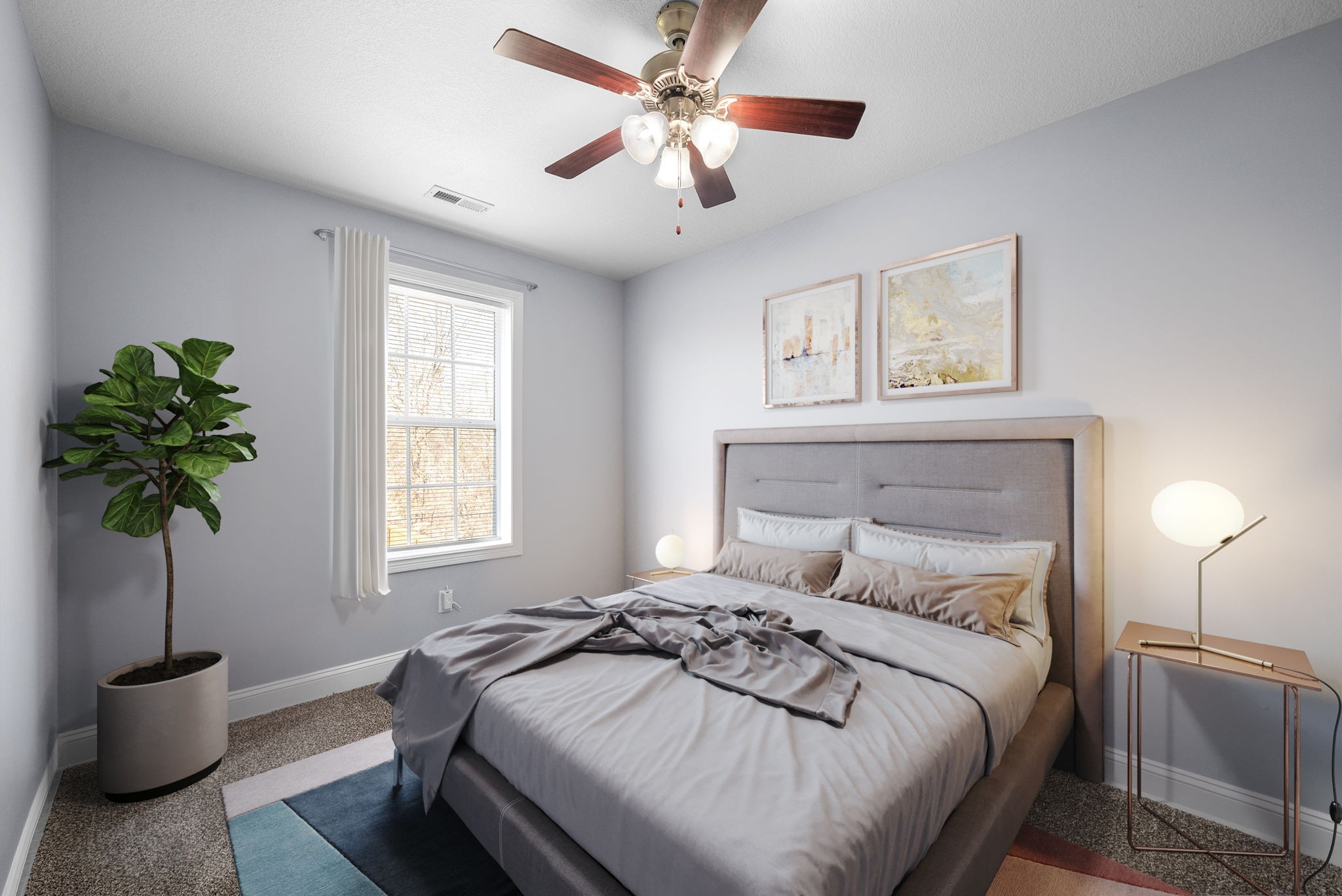 1145 Racker Drive Clarksville, TN 37043 - Photo 25 of 44 a bedroom with a bed and a potted plant