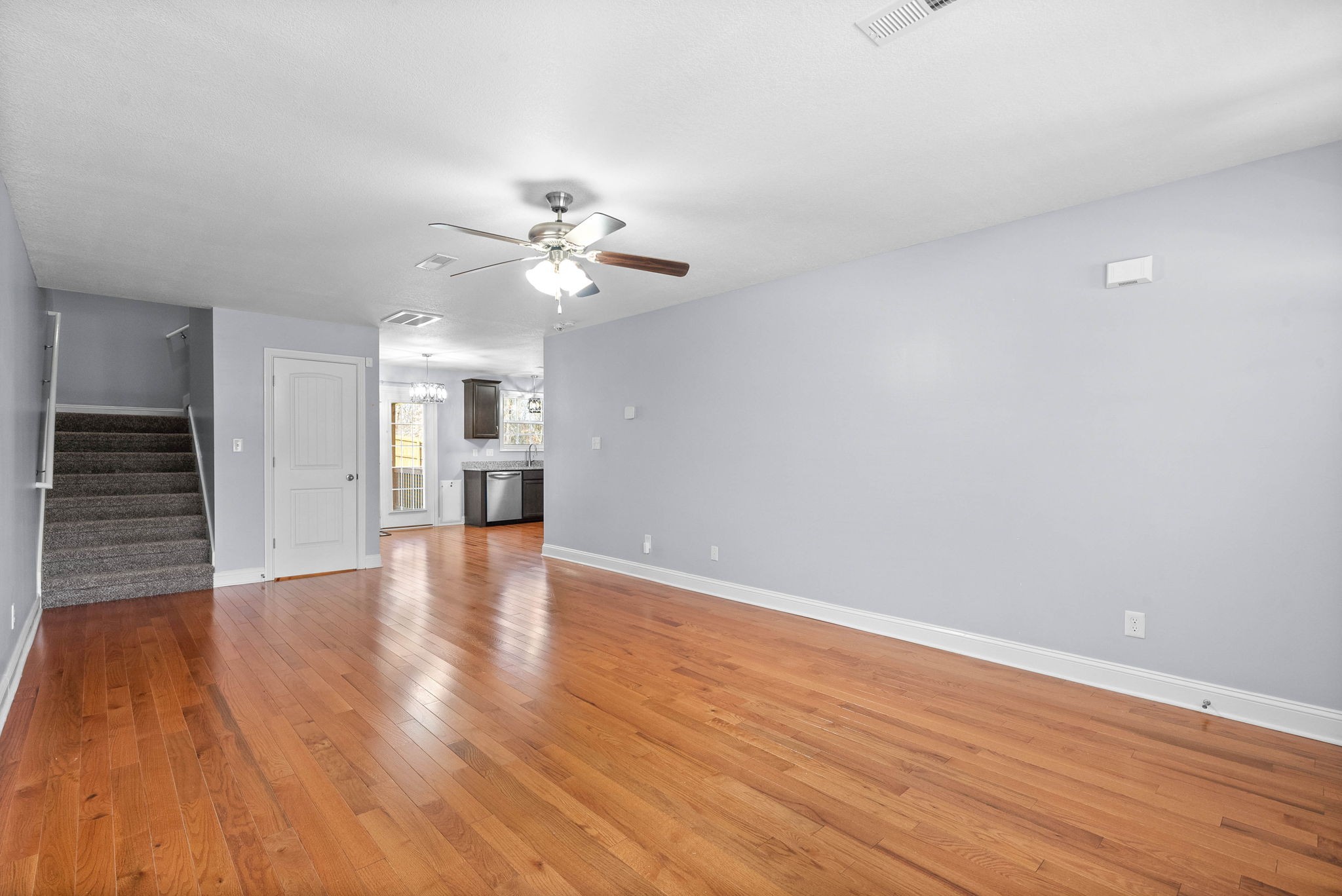 1145 Racker Drive Clarksville, TN 37043 - Photo 7 of 44 a view of an empty room with wooden floor