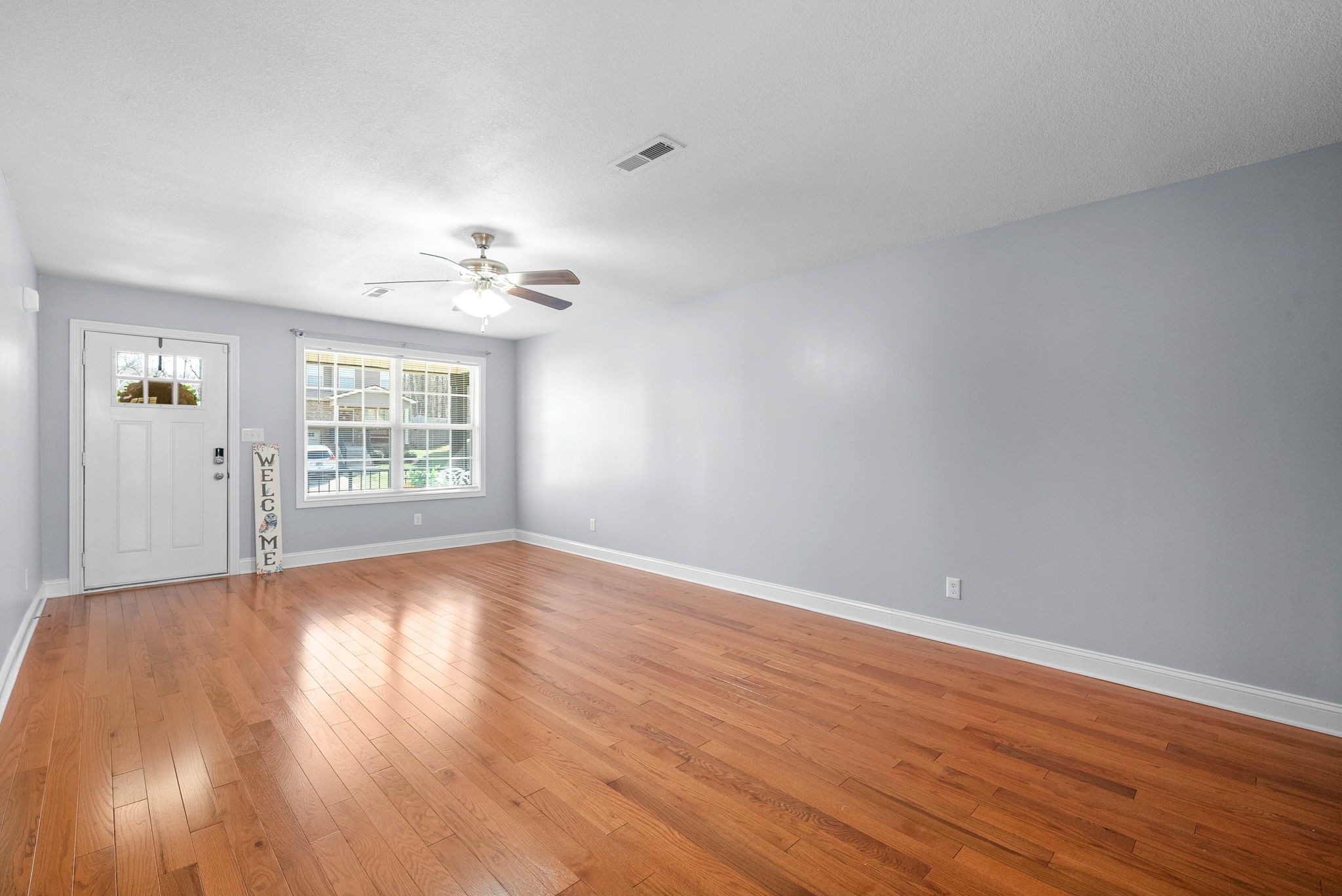 1145 Racker Drive Clarksville, TN 37043 - Photo 9 of 44 wooden floor in an empty room with a window