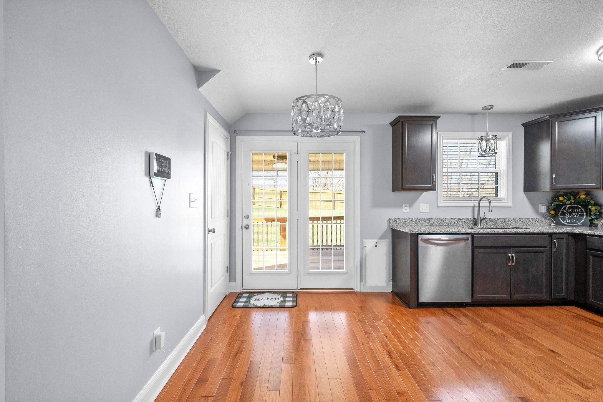 1145 Racker Drive Clarksville, TN 37043 - Photo 10 of 44 a kitchen with granite countertop a stove a sink and a wooden floors