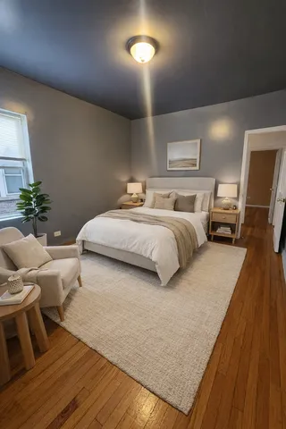 a bedroom with bed and window