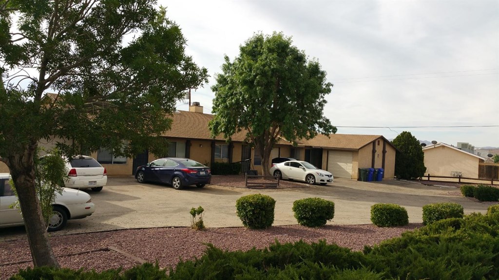 16145 Serrano Road Apple Valley, CA 92307 - Photo 1 of 1 a view of street with parked cars