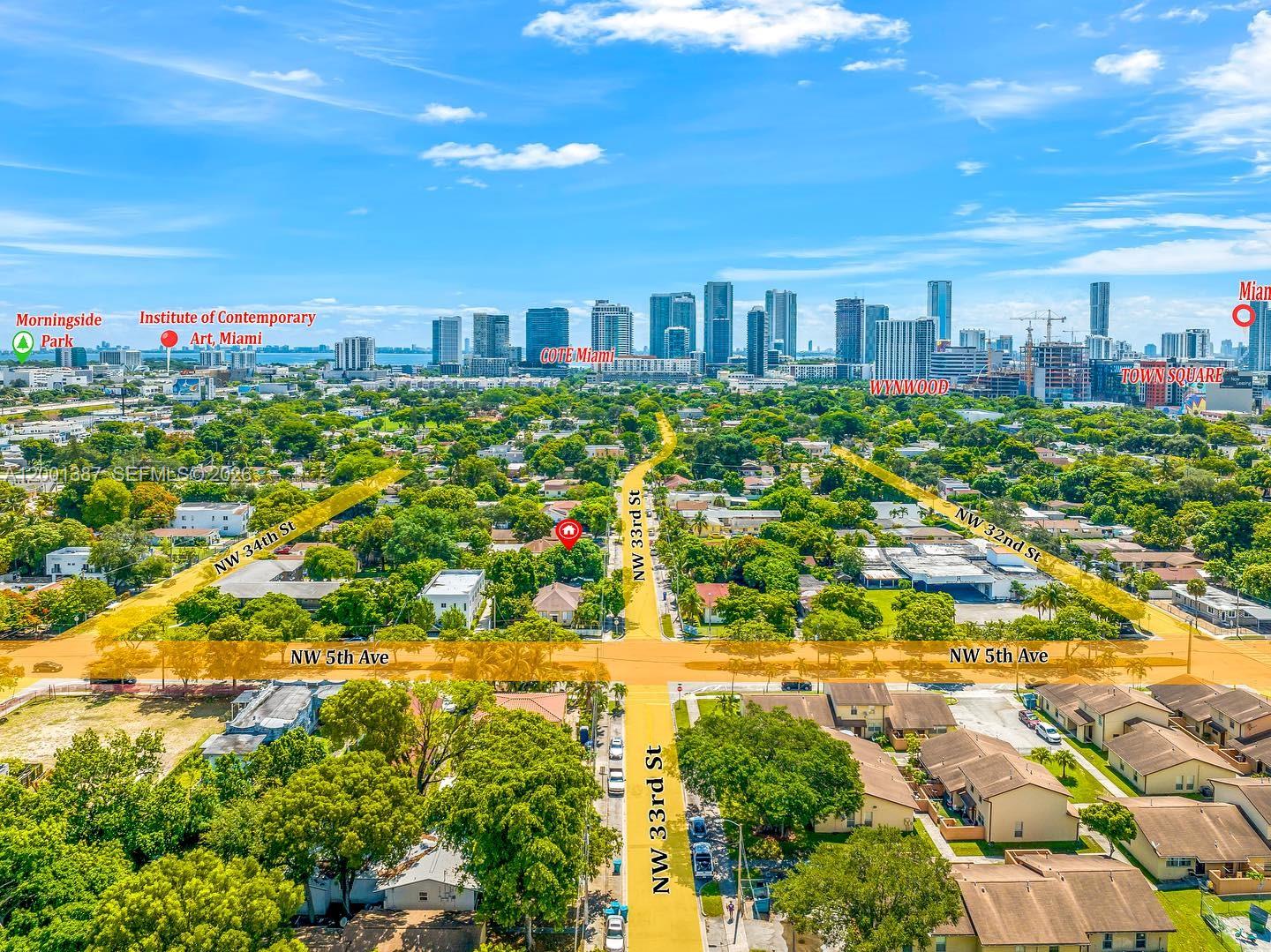 413 Northwest 33rd Street, Unit A Miami, FL 33127 - Photo 6 of 8 a view of a city of flower in a yard