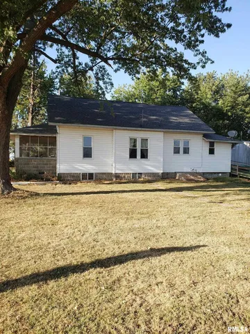 a house with trees in the background