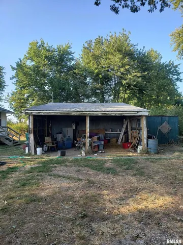 a view of a house that has a car parked in it
