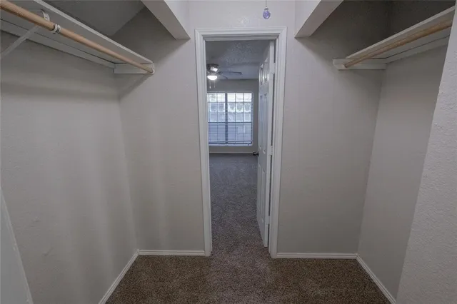 a view of an empty walk in closet