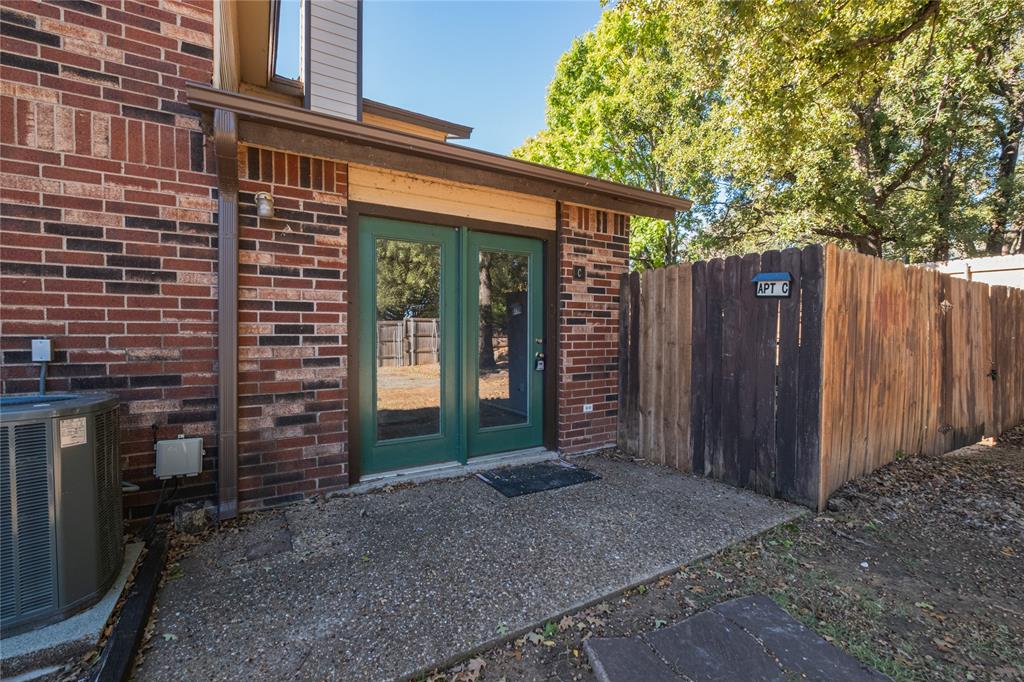 675 Harbor Drive North, Unit C Azle, TX 76020 - Photo 2 of 19 a backyard of a house with barbeque oven