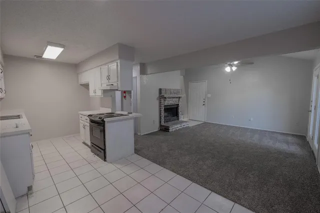 a kitchen with a sink and a stove top oven