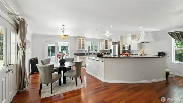 a view of kitchen with cabinets and wooden floor