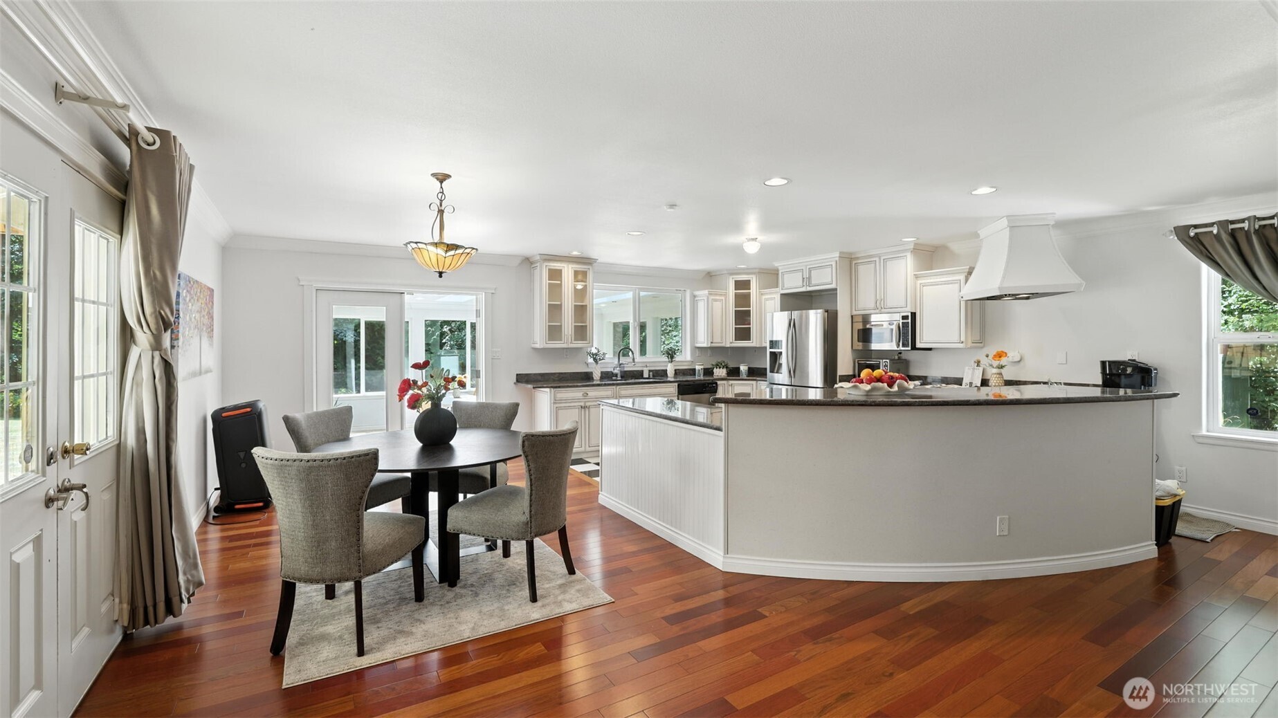 18911 Southeast 144th Street Renton, WA 98059 - Photo 13 of 39 a view of kitchen with cabinets and wooden floor