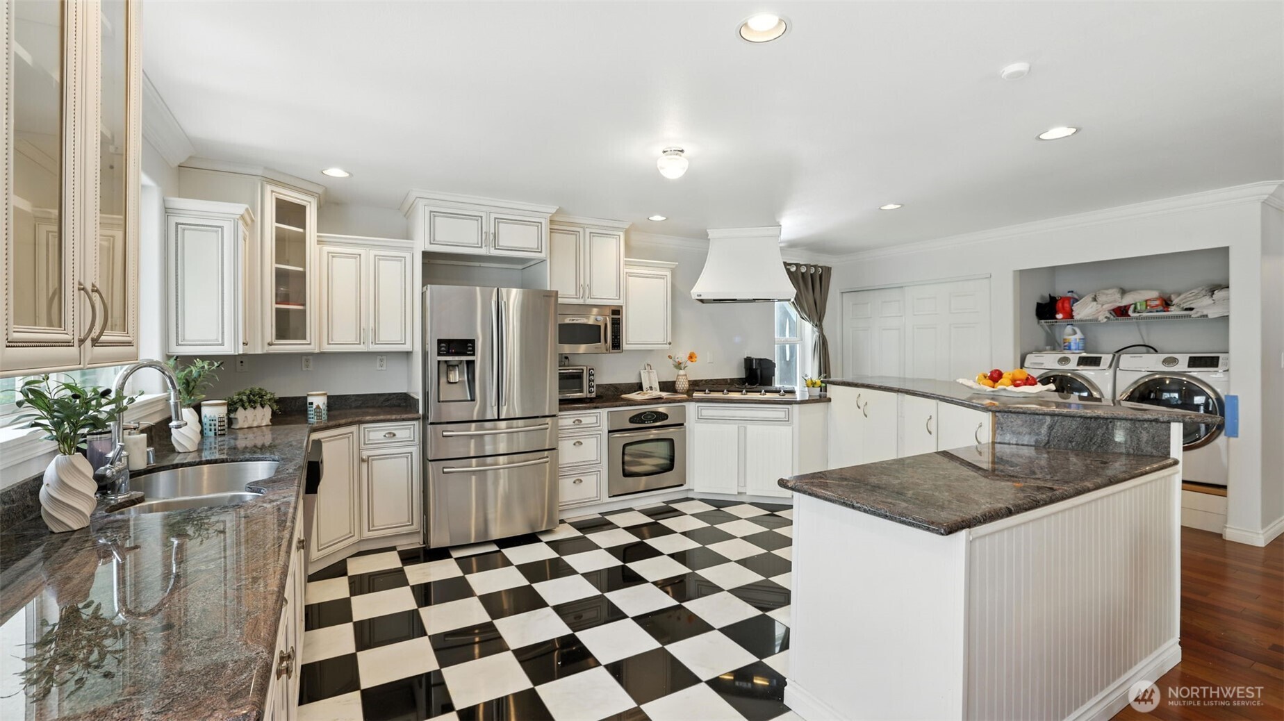 18911 Southeast 144th Street Renton, WA 98059 - Photo 14 of 39 a kitchen with stainless steel appliances granite countertop a refrigerator and a sink