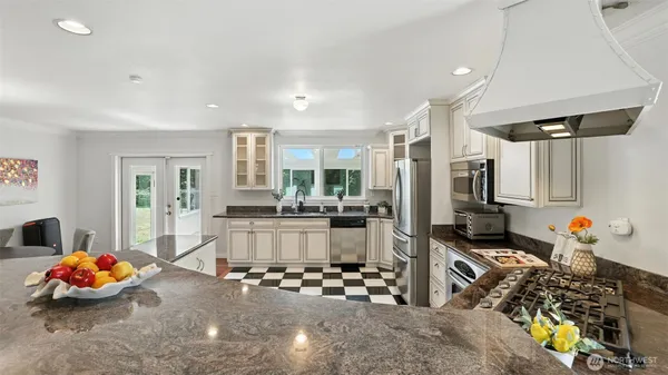 a room with lots of appliances and cabinets