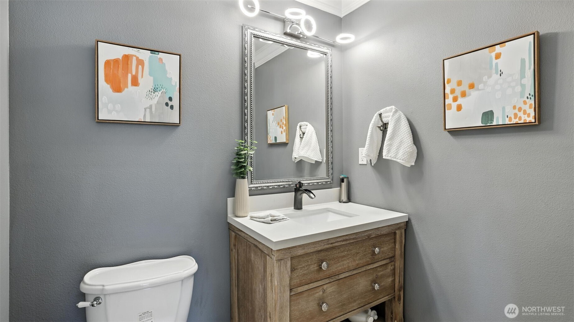18911 Southeast 144th Street Renton, WA 98059 - Photo 19 of 39 a bathroom with a toilet a sink and a mirror