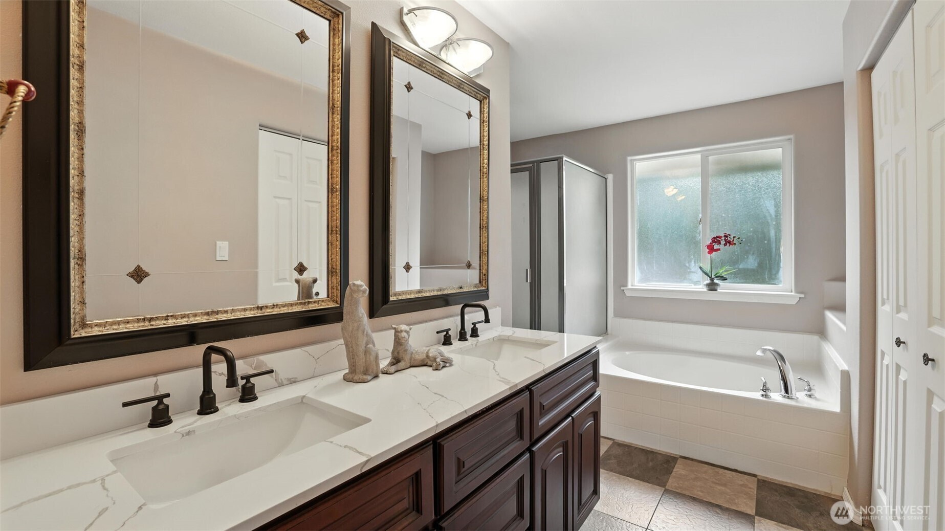 18911 Southeast 144th Street Renton, WA 98059 - Photo 23 of 39 a bathroom with a tub a sink and mirror