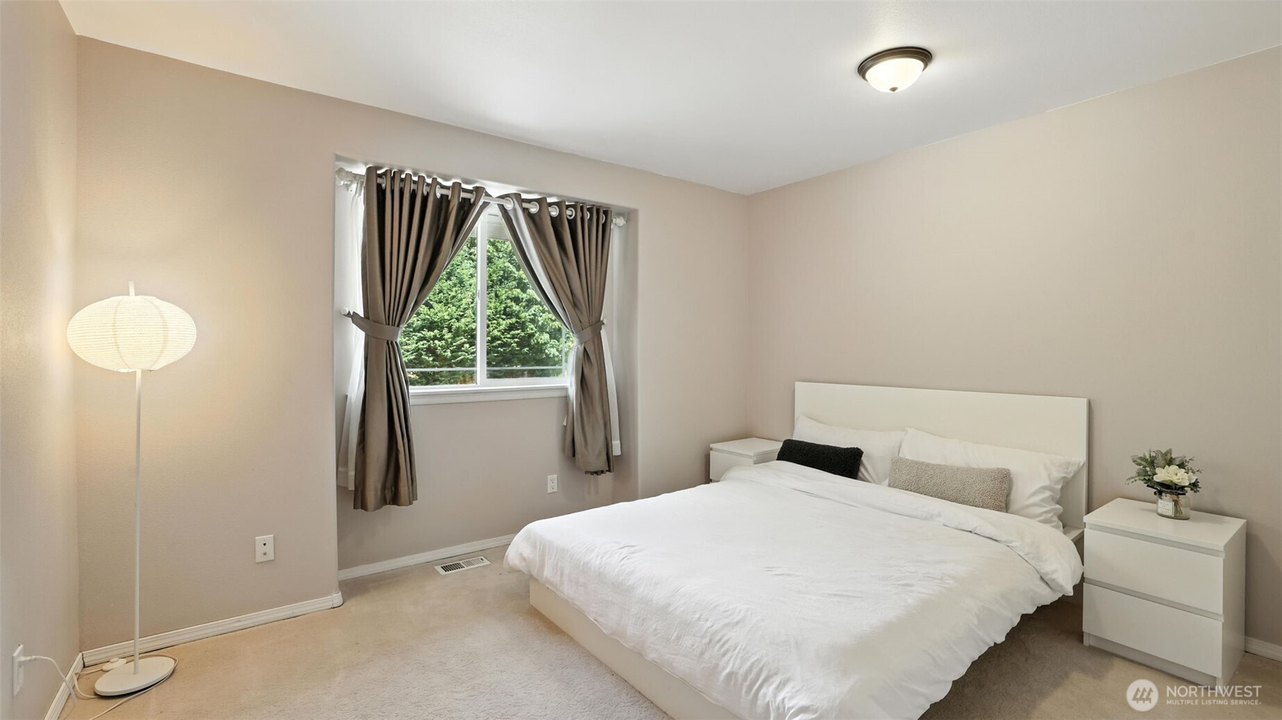 18911 Southeast 144th Street Renton, WA 98059 - Photo 24 of 39 a bedroom with a bed and a window