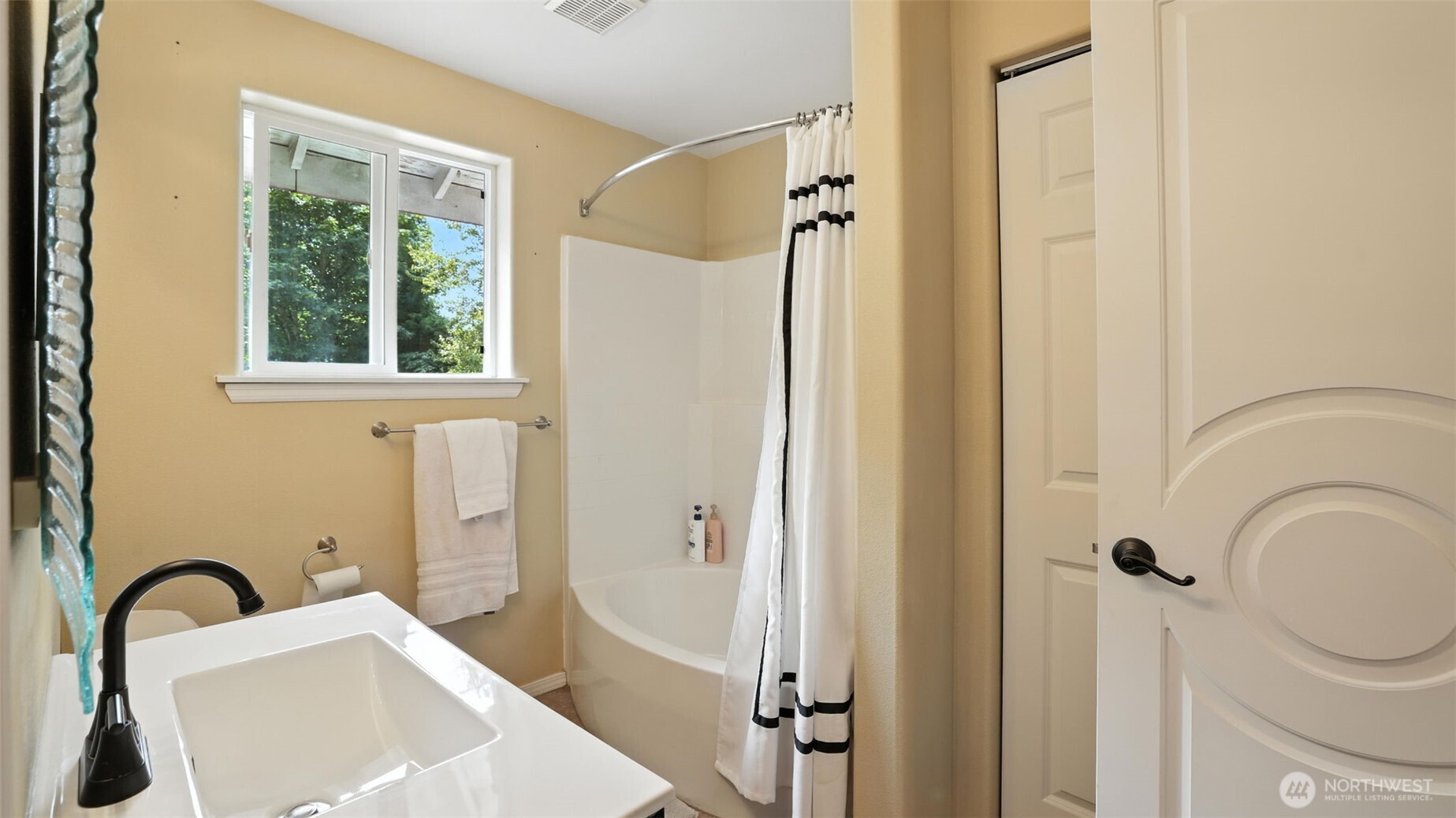 18911 Southeast 144th Street Renton, WA 98059 - Photo 26 of 39 a bathroom with a sink toilet and shower
