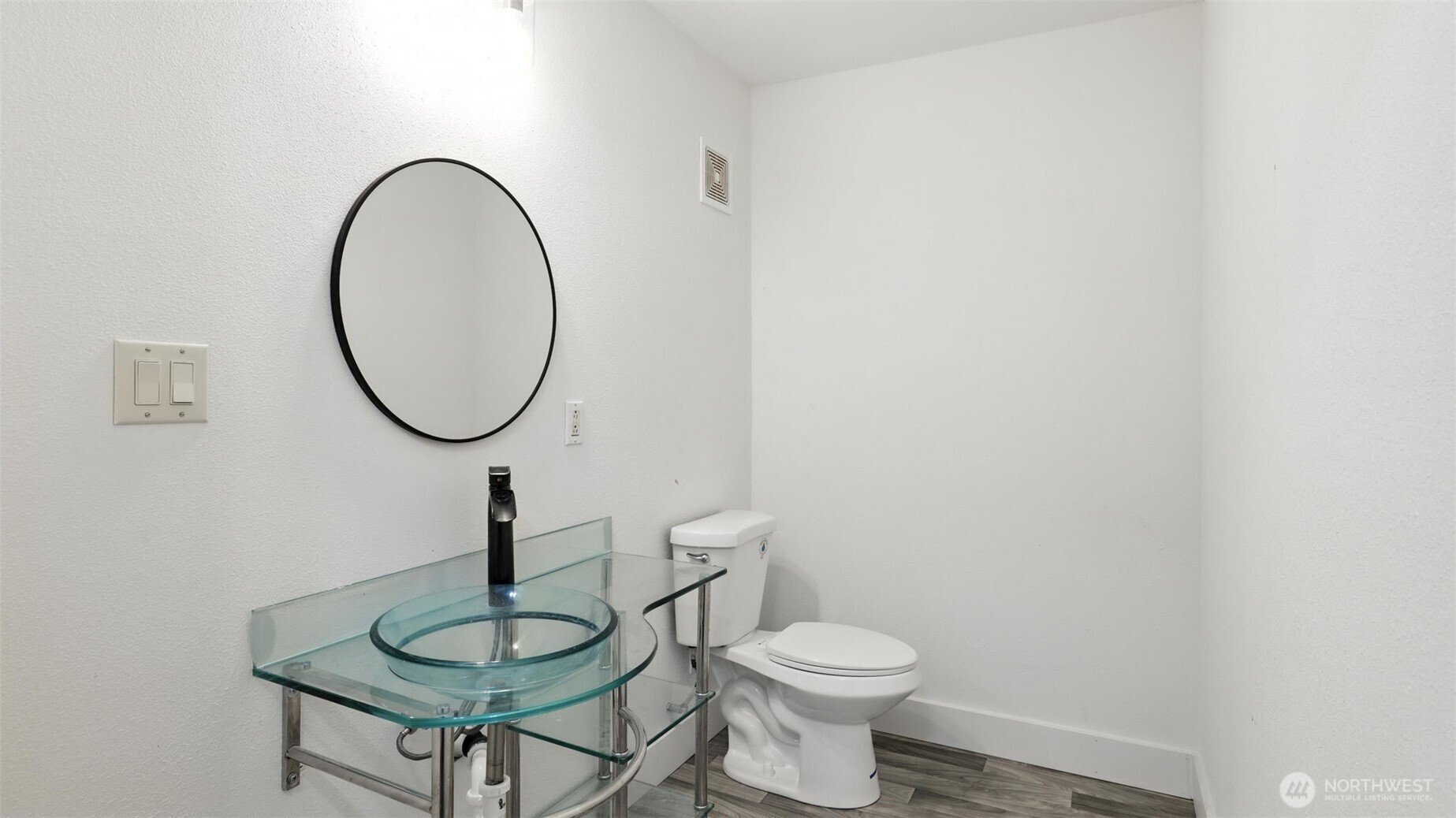 18911 Southeast 144th Street Renton, WA 98059 - Photo 27 of 39 a bathroom with a toilet a sink and a mirror