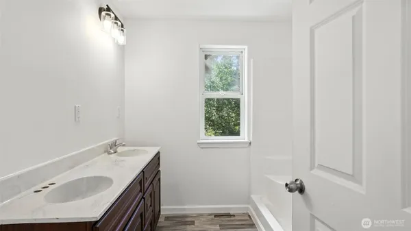 a bathroom with a sink and a bathtub
