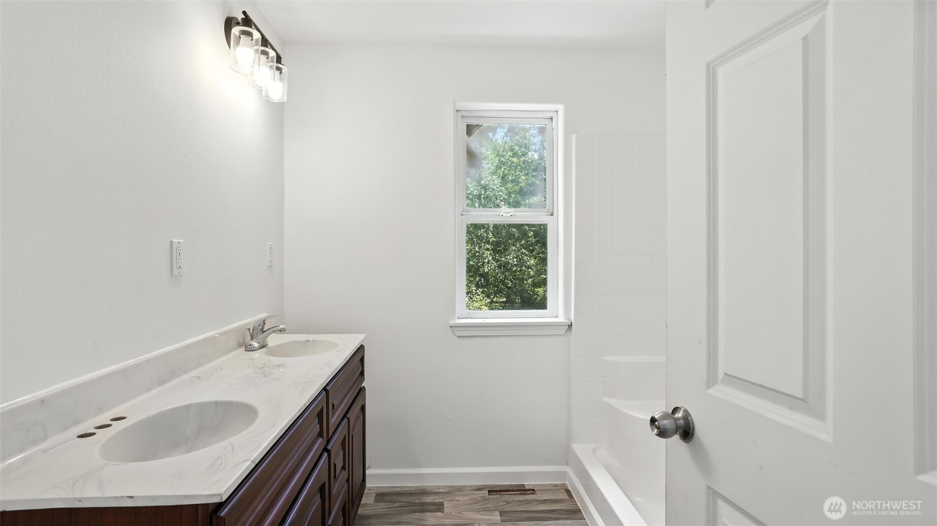 18911 Southeast 144th Street Renton, WA 98059 - Photo 28 of 39 a bathroom with a sink and a bathtub