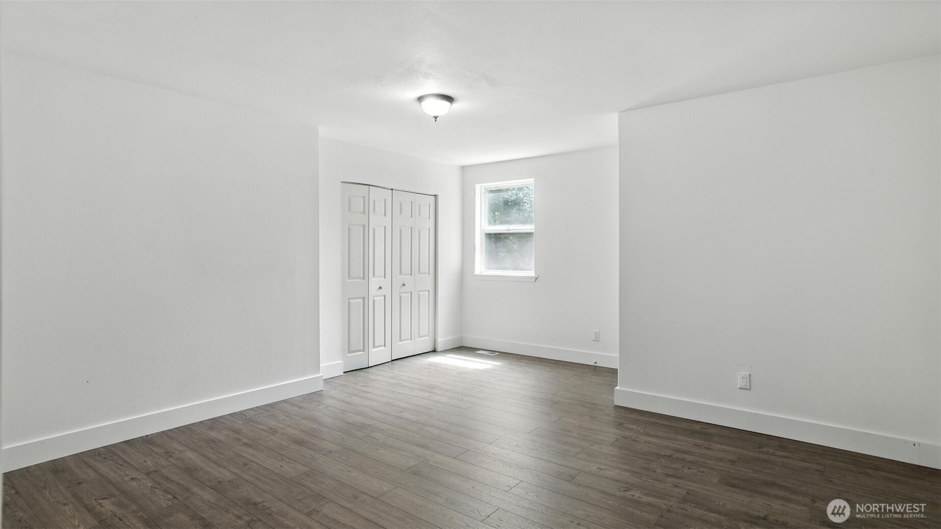 18911 Southeast 144th Street Renton, WA 98059 - Photo 32 of 39 a view of an empty room with wooden floor