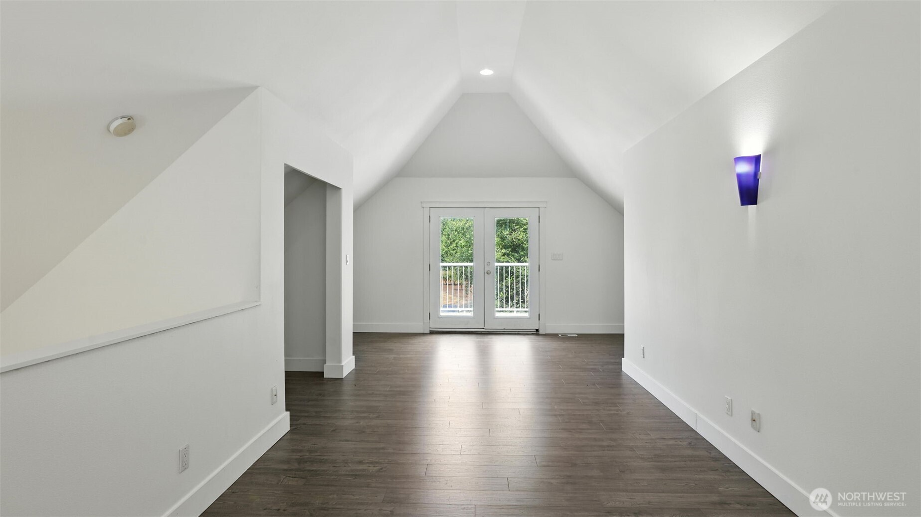 18911 Southeast 144th Street Renton, WA 98059 - Photo 35 of 39 a view of an empty room with wooden floor and a window