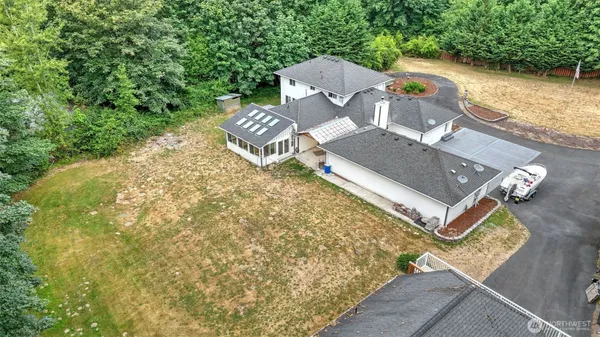 aerial view of a house with backyard