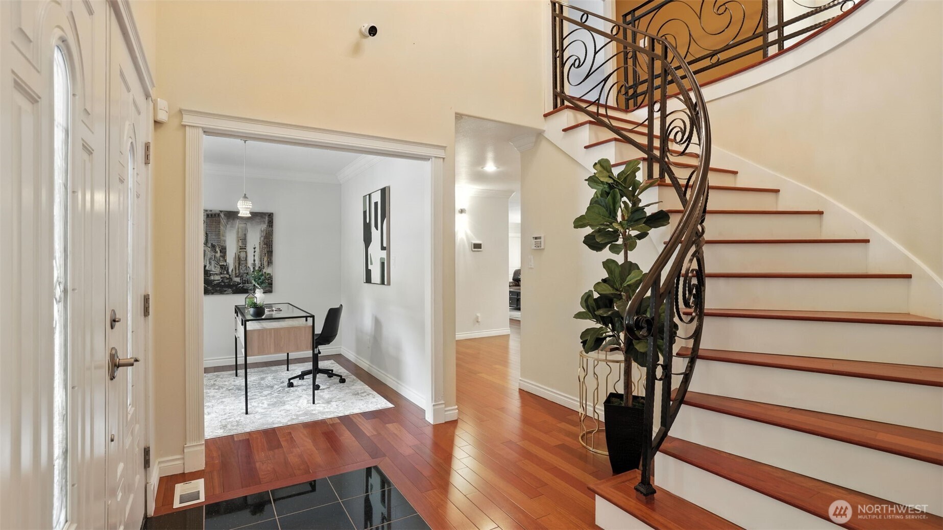 18911 Southeast 144th Street Renton, WA 98059 - Photo 6 of 39 a view of a hallway with wooden floor and stairs