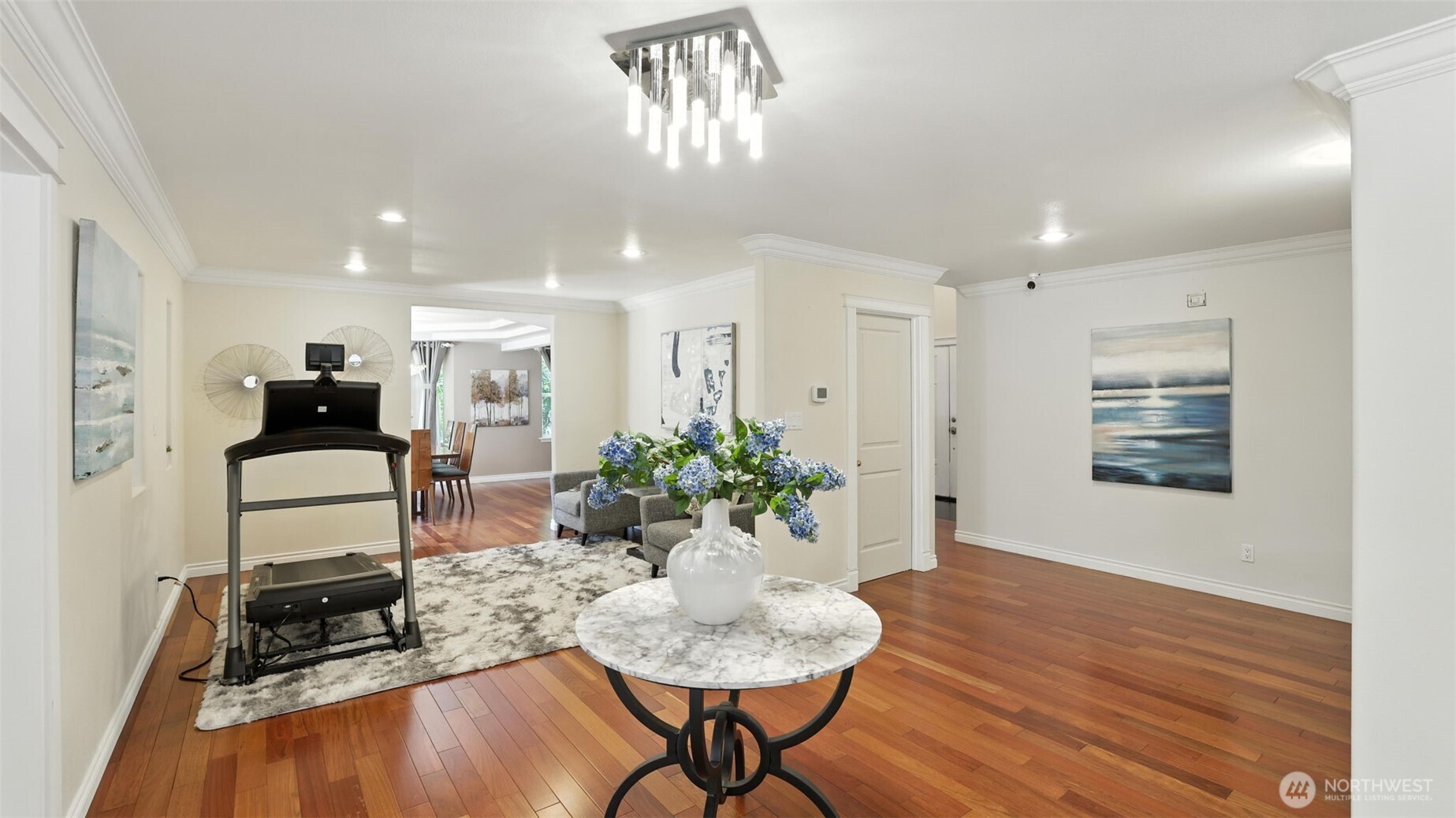 18911 Southeast 144th Street Renton, WA 98059 - Photo 10 of 39 a living room with furniture and a chandelier