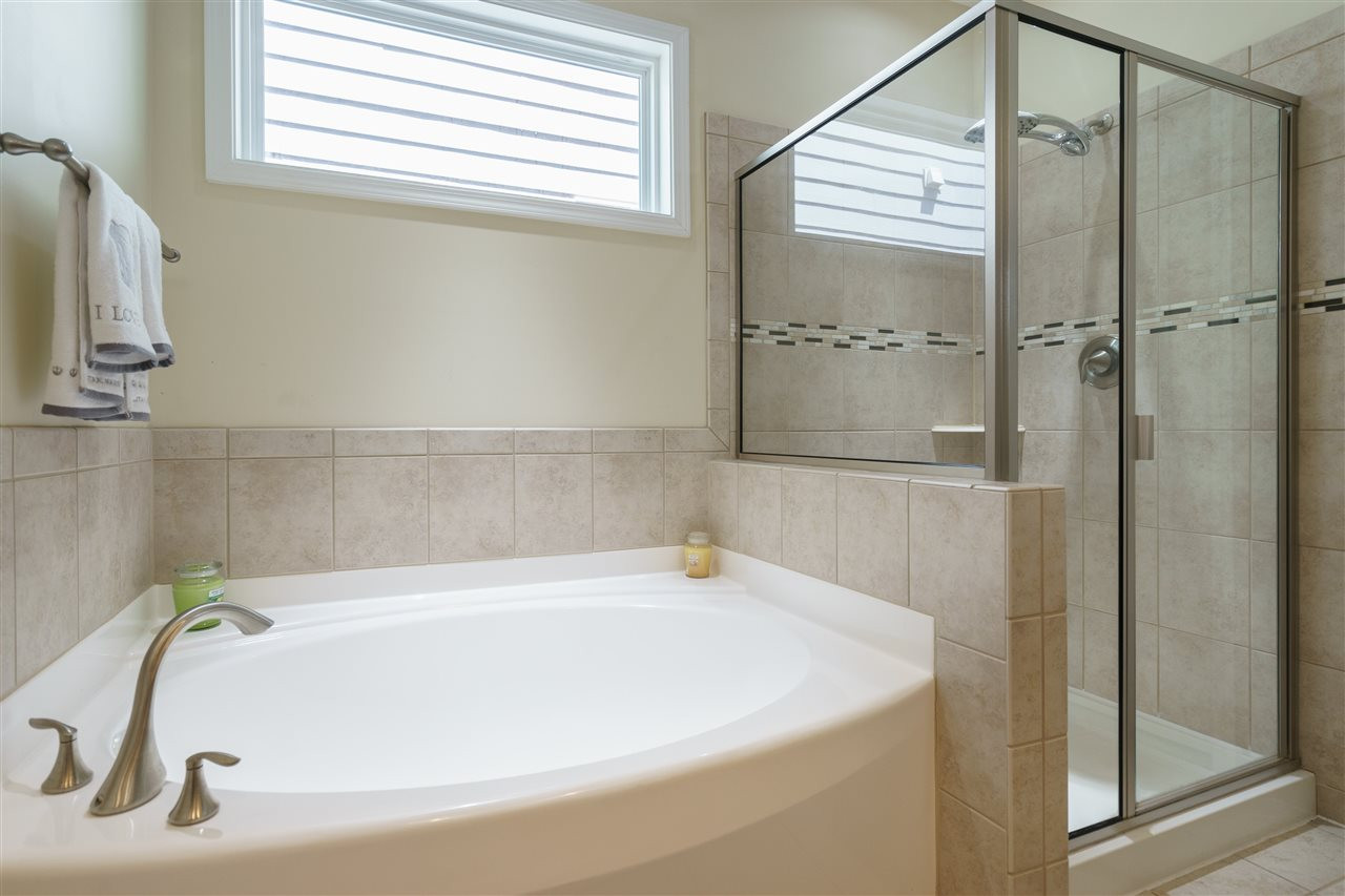 5622 Wade Park Boulevard Raleigh, NC 27607 - Photo 14 of 25 RELAX IN YOUR GARDEN TUB OR SHOWER IN THE GLASS ENCLOSED CERAMIC TILE SHOWER! MASTER BATHROOM