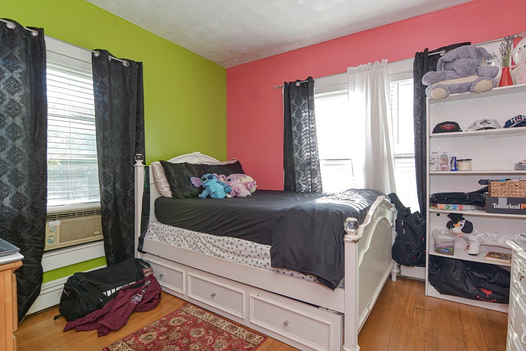 110 Danforth Street Framingham, MA 01701 - Photo 20 of 28 a bed sitting in a bedroom next to a window