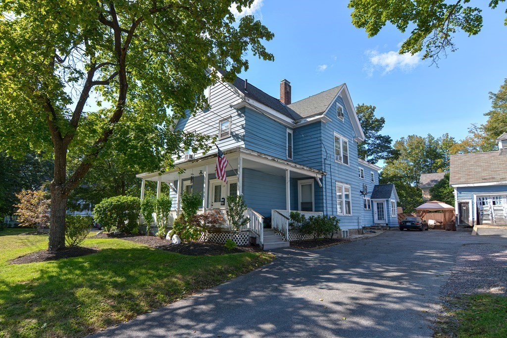 110 Danforth Street Framingham, MA 01701 - Photo 2 of 28 a front view of a house with garden
