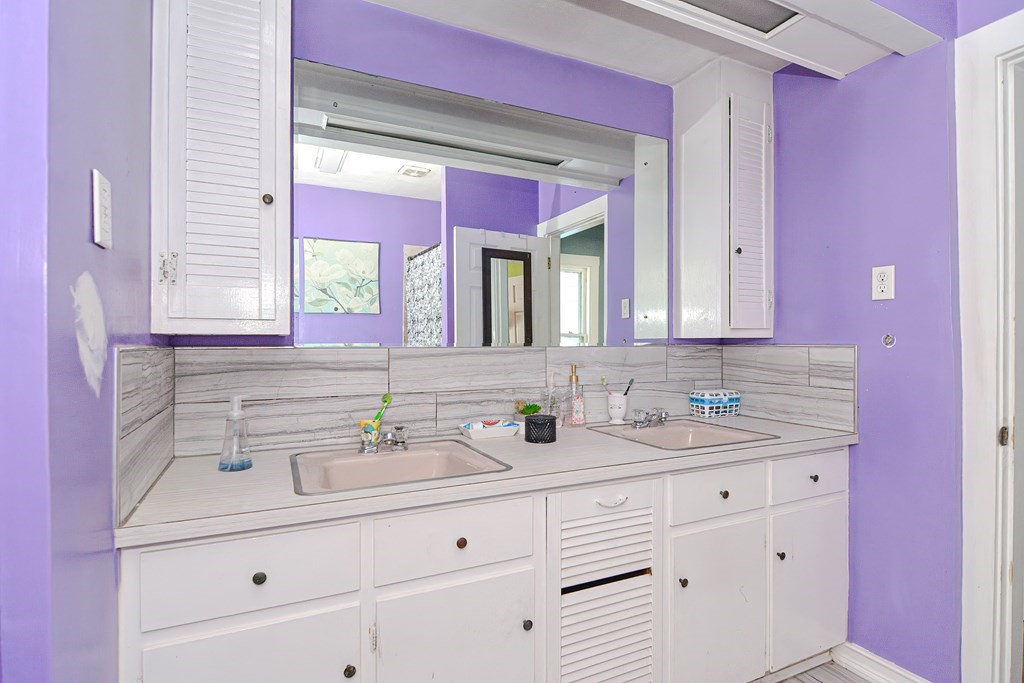 110 Danforth Street Framingham, MA 01701 - Photo 21 of 28 a bathroom with a sink vanity and a mirror