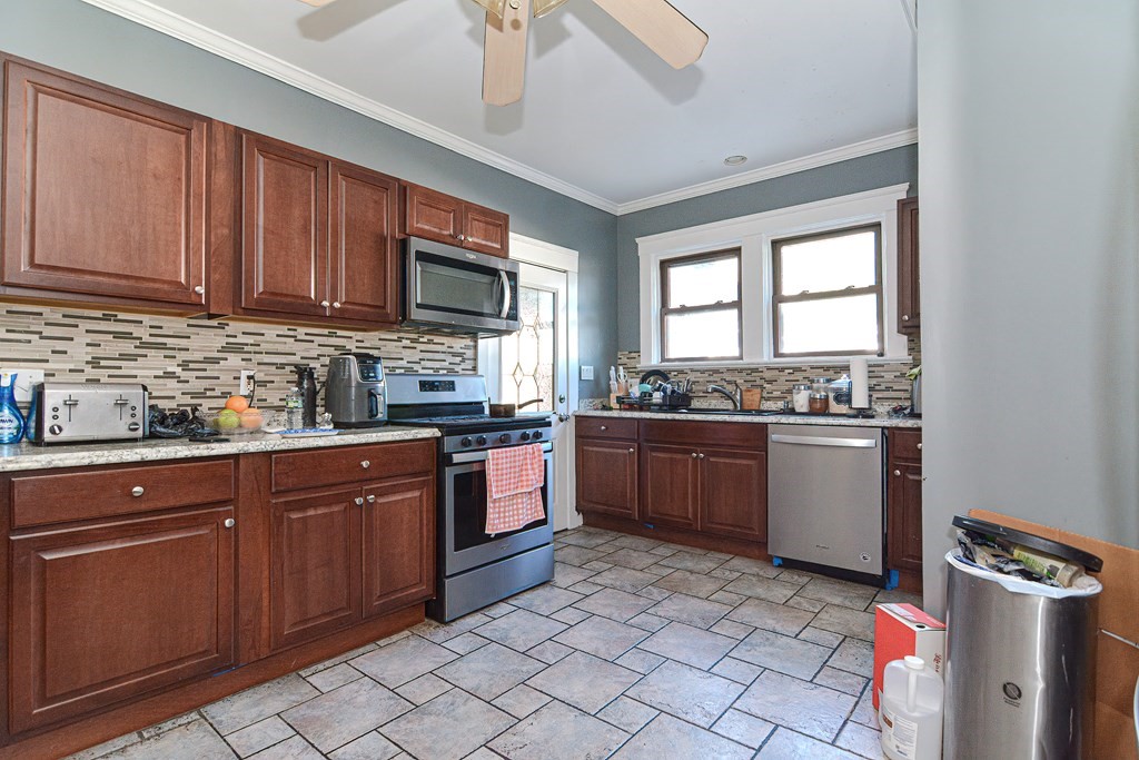 110 Danforth Street Framingham, MA 01701 - Photo 23 of 28 a kitchen with a sink window and stainless steel appliances