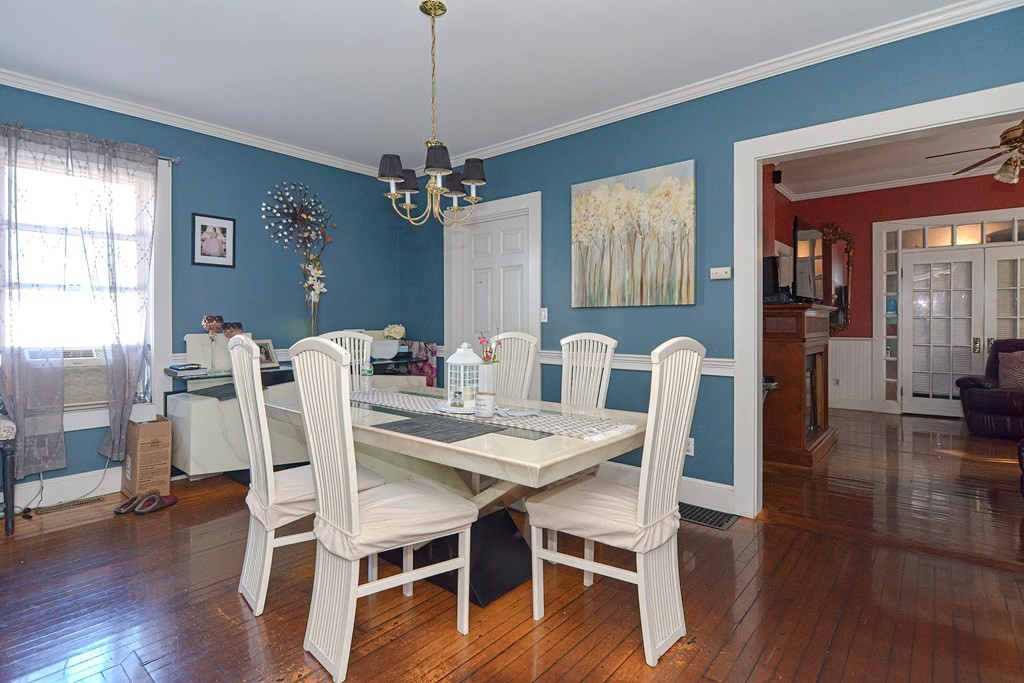 110 Danforth Street Framingham, MA 01701 - Photo 24 of 28 a view of a dining room with furniture window and wooden floor