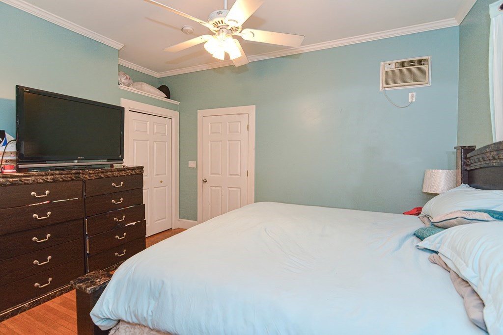 110 Danforth Street Framingham, MA 01701 - Photo 27 of 28 a bedroom with a bed and a flat screen tv