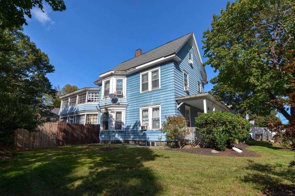 110 Danforth Street Framingham, MA 01701 - Photo 3 of 28 a front view of a house with a garden