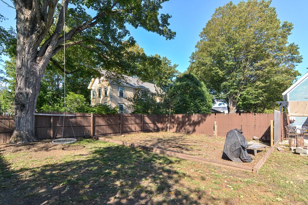 110 Danforth Street Framingham, MA 01701 - Photo 7 of 28 a view of a backyard with snow and tree