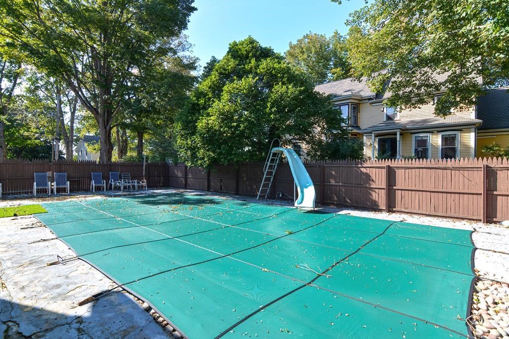 110 Danforth Street Framingham, MA 01701 - Photo 10 of 28 a view of a backyard with table and chairs and a barbeque