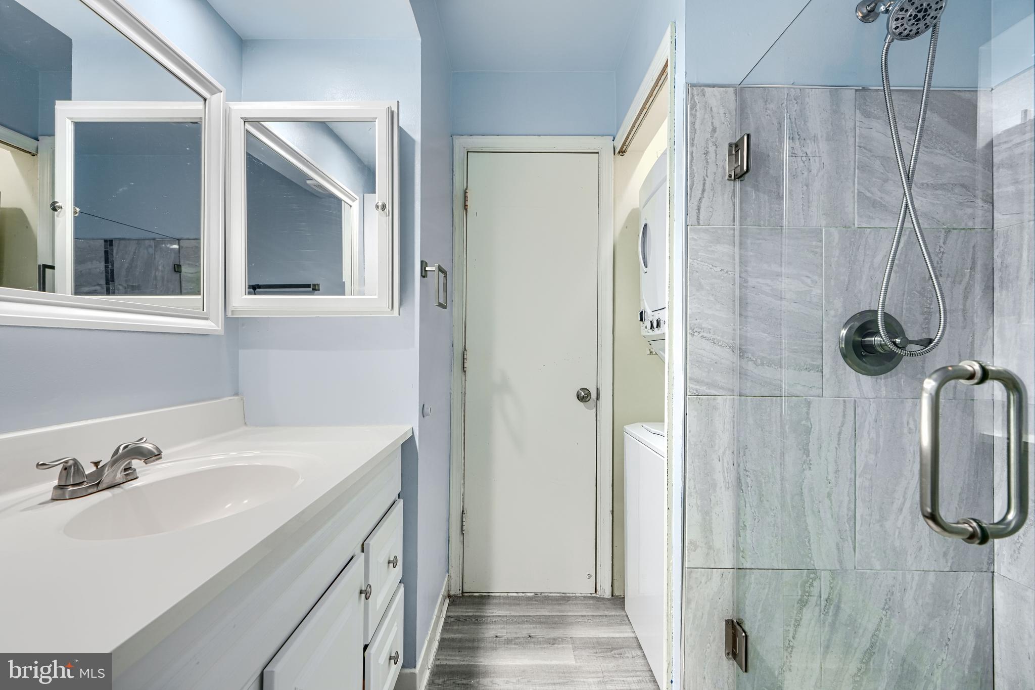 14235 Jib Street, Unit 7342 Laurel, MD 20707 - Photo 12 of 25 a bathroom with a sink vanity granite shower and a mirror