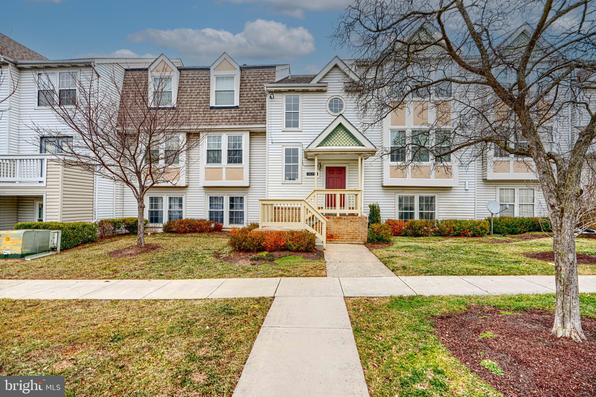 14235 Jib Street, Unit 7342 Laurel, MD 20707 - Photo 2 of 25 a front view of a house with garden
