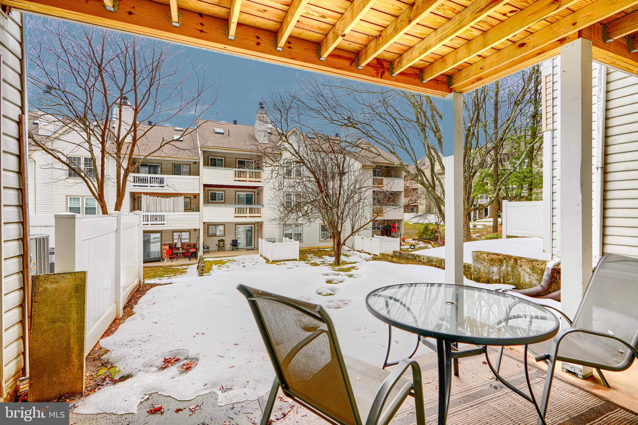 14235 Jib Street, Unit 7342 Laurel, MD 20707 - Photo 25 of 25 a view of a dinning table and chairs in the patio
